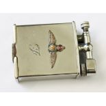 A Parker Beacon silver plated lighter having applied RAF motif to front, length 5cm.