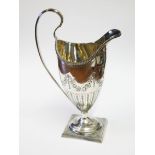 A George III bright cut engraved silver cream jug of helmet form on square pedestal base, John