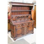 A reproduction Ipswich style aged oak dresser. W153cm D51cm H199cm.