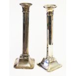 A pair of hallmarked silver candlesticks, height23cm. A/F.