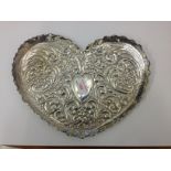 An embossed hallmarked silver heart shaped tray, length 30cm, wt. 8oz.