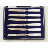 A cased set of six hallmarked silver and mother of pearl knives.