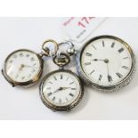 A group of three silver pocket watches.