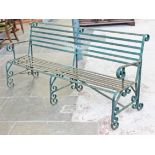 A wrought iron garden bench. L186cm D62cm H87cm.