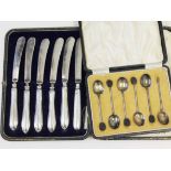 Hallmarked silver handled knives together with hallmarked silver bean spoons.