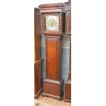 A Georgian oak long case clock the silvered brass dial inscribed 'Baker Wigan'. H210cm.