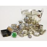 A silver plated biscuit barrel and contents to include various hallmarked silver and silver plated