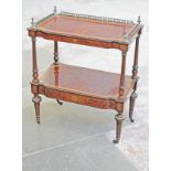 A Victorian amboyna and gilt metal mounted two tier what not with lower drawer, fluted columns and