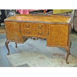 A 1950s burr walnut sideboard in the manner of Epstein. L159cm D53cm H102cm.