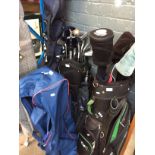 2 BAGS OF GOLF CLUBS AND A GOLF TROLLEY
