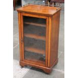 A Victorian inlaid mahogany music cabinet with rail back and glazed door. W54cm D37cm H98cm.