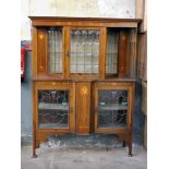 An Edwardian Art Nouveau style inlaid mahogany display cabinet with leaded glass. W177cm D44cm