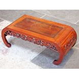 A Chinese carved hardwood opium table. L92.5cm.