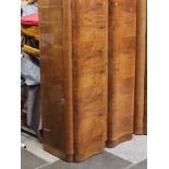 An Art Deco walnut wardrobe with fitted interior. W105cm D52cm H173cm.