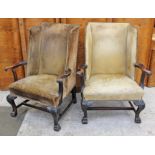 A pair of George II wingback mahogany armchairs circa 1750 with scroll arms, cabriole