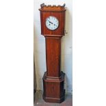 A 1920s oak granddaughter clock with "castle' pediment. H139cm.