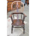 A 19th Century elm Windsor chair. H113cm.