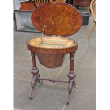 A Victorian burr walnut sewing table. H72cm.