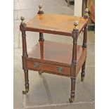 A William IV mahogany two tier table with brass acorn finials and brass castors. H76cm.