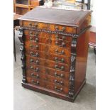 A Victorian mahogany wellington chest with tooled leather writing slope top and aesthetic stlye gilt