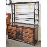 A Georgian 18th Century oak dresser with plate rack back. L157cm D54cm H194cm.