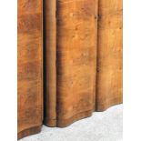 An Art Deco walnut wardrobe. W126cm D63cm H186cm.