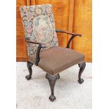 A George II and later mahogany armchair having needlework back, scroll arms, cabriole