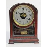 A Bulle patent mahogany mantel clock. H31cm.