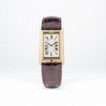 A FINE & RARE GENTLEMAN'S 18K SOLID GOLD & DIAMOND CARTIER TANK BASCULANTE WRIST WATCH CIRCA