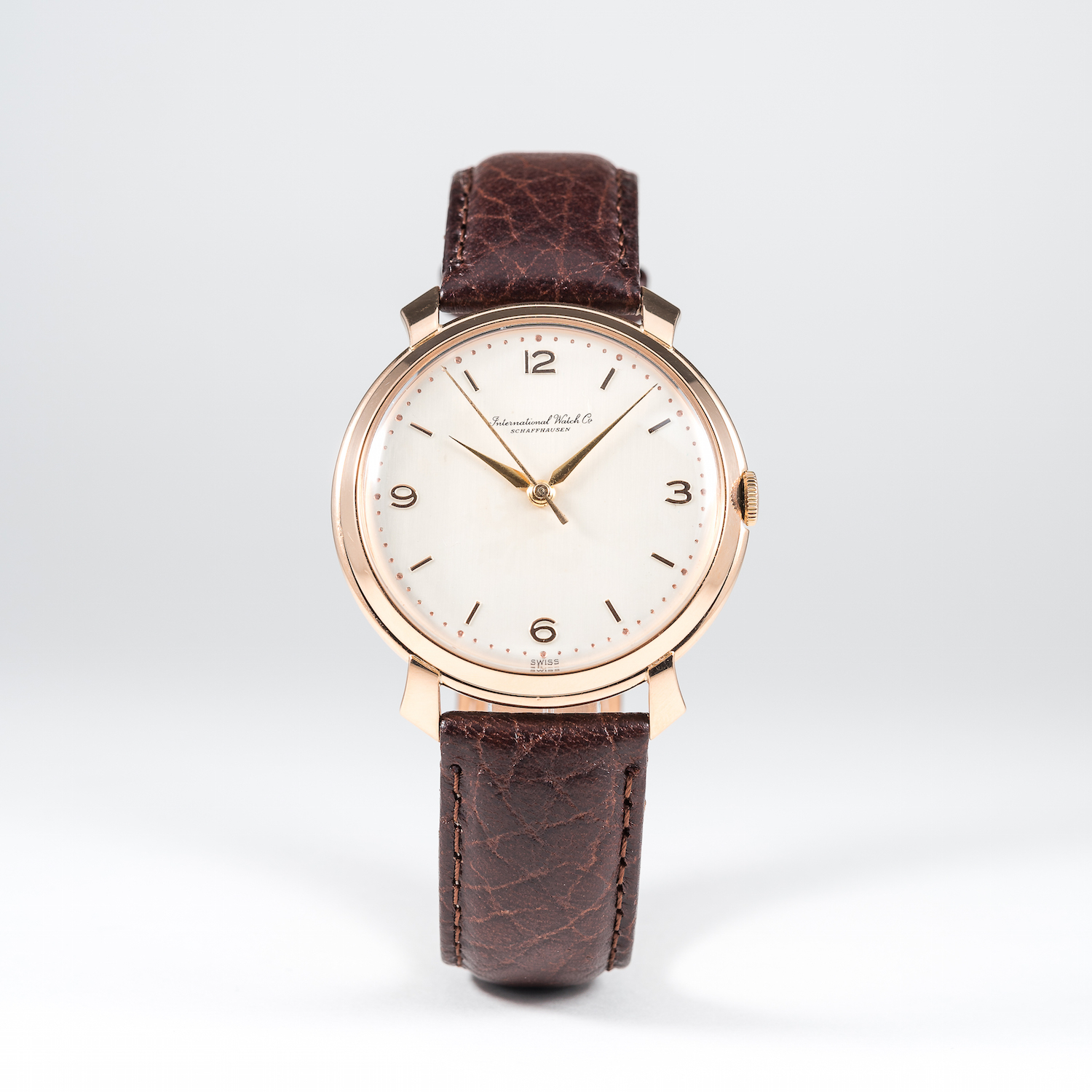 A RARE GENTLEMAN'S LARGE SIZE 18K SOLID PINK GOLD IWC WRIST WATCH CIRCA 1950s 
D: Silver dial with