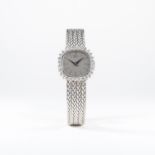 A LADIES 18K SOLID WHITE GOLD & DIAMOND CHOPARD BRACELET WATCH CIRCA 1980, REF. 514
D: Silver dial