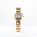 A LADIES 18K SOLID GOLD CARTIER ELLIPSE BRACELET WATCH CIRCA 1990s 
D: Silver dial with black