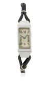 A RARE LADIES STAINLESS STEEL CARTIER FRANCE WRIST WATCH CIRCA 1930s D: White enamel dial with Roman