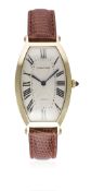 A FINE GENTLEMAN'S 18K SOLID GOLD CARTIER TONNEAU WRIST WATCH CIRCA 1990s D: Silver guilloche dial