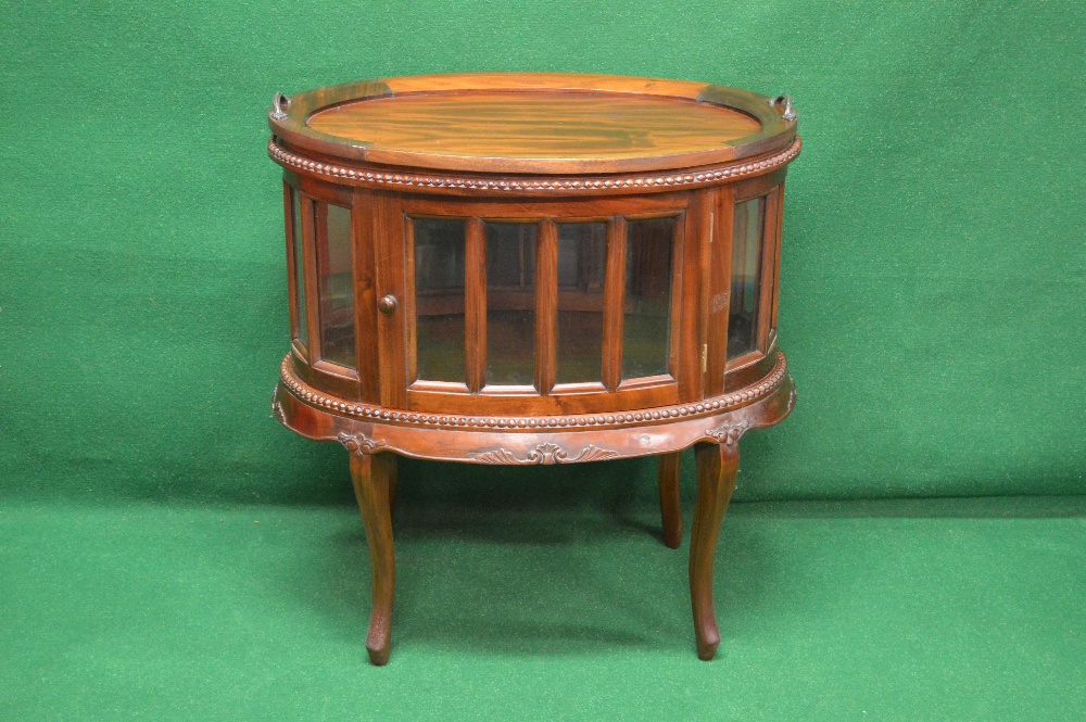 Late 20th century mahogany oval tray top display cabinet,