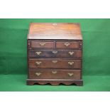 Georgian oak bureau having fall front opening to reveal fitted interior over two short and three