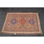 Brown ground rug with blues,