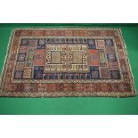 Beige ground rug having a blue and red pattern - 79" x 50"