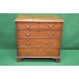 Georgian mahogany chest of four long graduated drawers having brass handles and standing on bracket