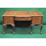 Mahogany kneehole desk having three piece leather insert top with bow front and floral carved