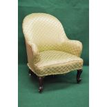 Victorian upholstered nursing armchair having shaped seat front and standing on cabriole legs