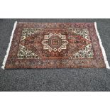 Red ground rug having black,