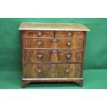 19th century walnut chest of drawers having cross banded top and moulded edge over two short and