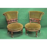 Good quality pair of Victorian nursing chairs with padded scroll backs and carved back rails over