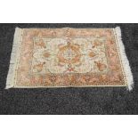 Signed beige ground rug having red,