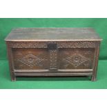 Oak carved coffer having two plank top lifting to reveal open space,