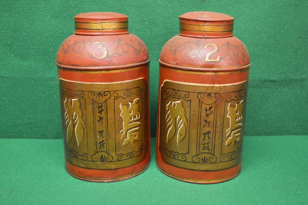 Pair of Tollware painted tea canisters numbered 2 and 3,