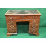 Mahogany kneehole desk having red leather insert over single long drawer supported on single banks