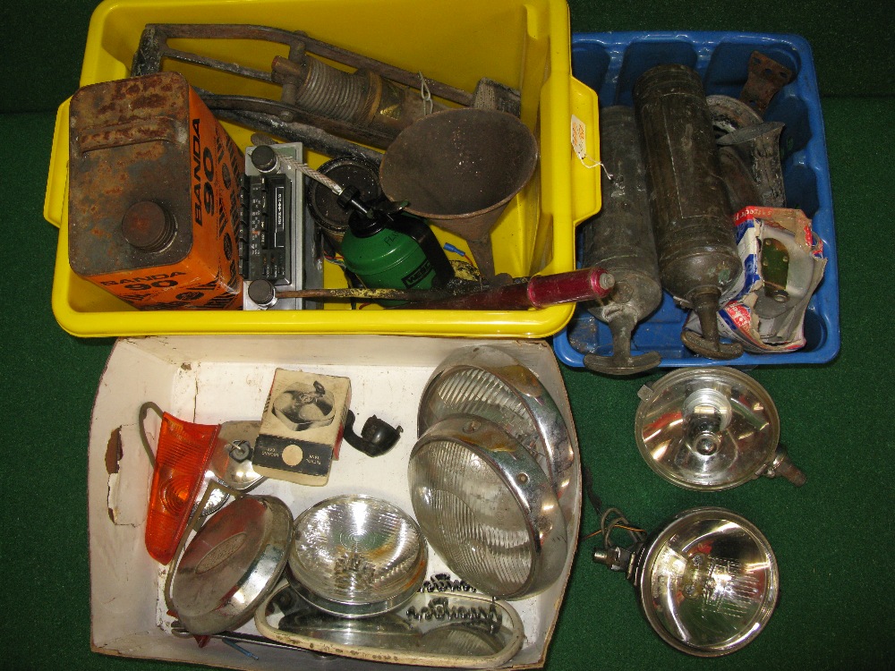 Three boxes containing two brass extinguishers, Lucas spot lamps, rear lenses, large foot pump,