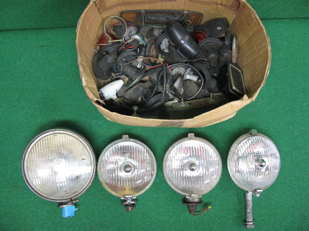 Box containing Lucas spot lamps together with other light fittings